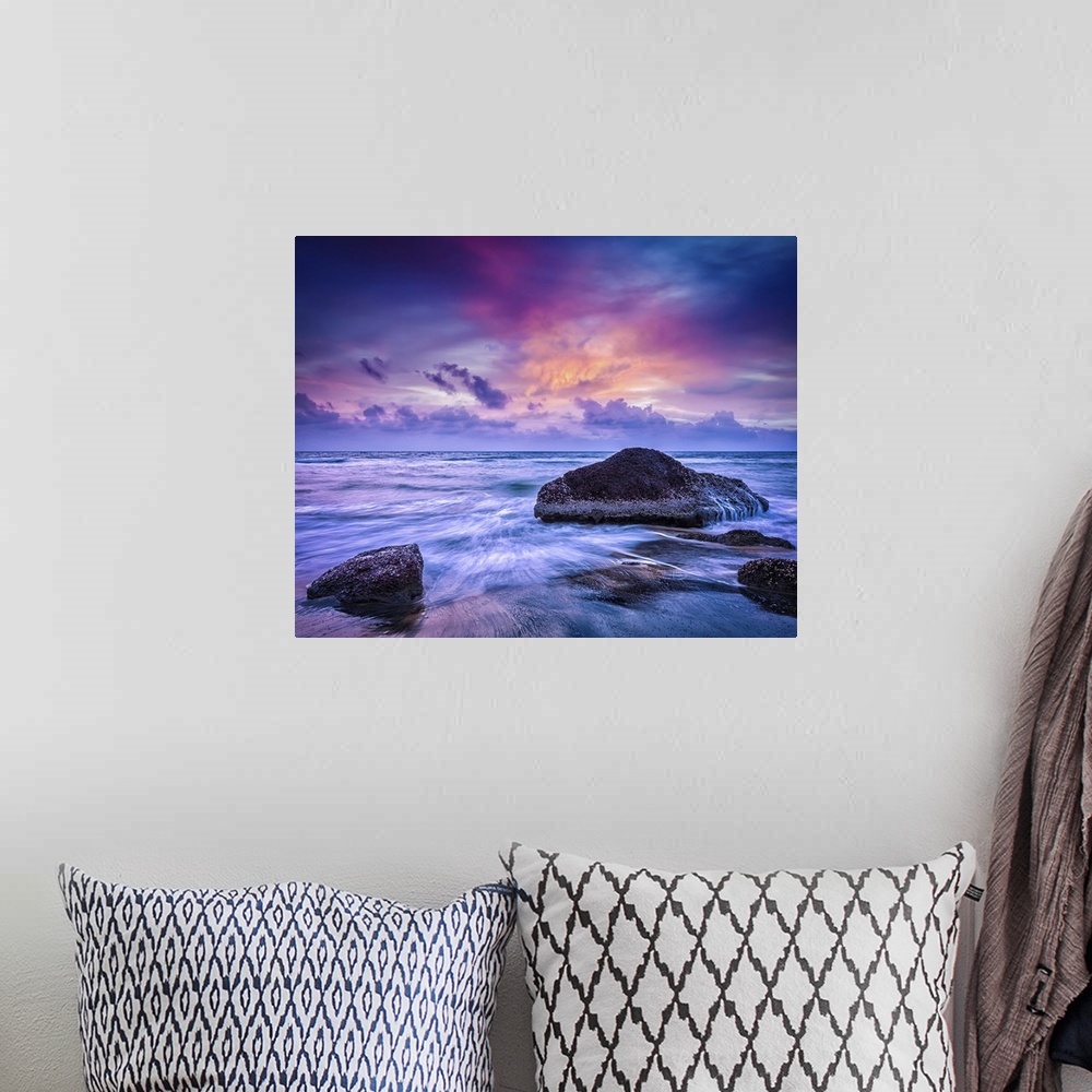 A bohemian room featuring Waves And Rocks On Beach At Sunset