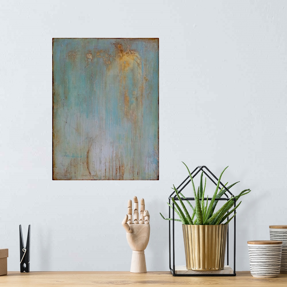 A bohemian room featuring Vertical abstract painting created with a muted blue turning into gray with streaking lines in go...