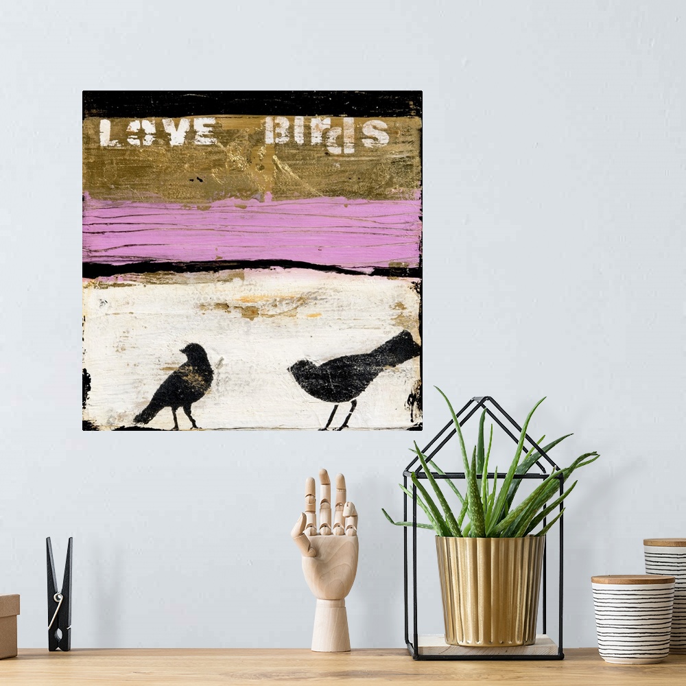 A bohemian room featuring A square contemporary abstract painting of gold, pink, black, and white horizontal sections with ...