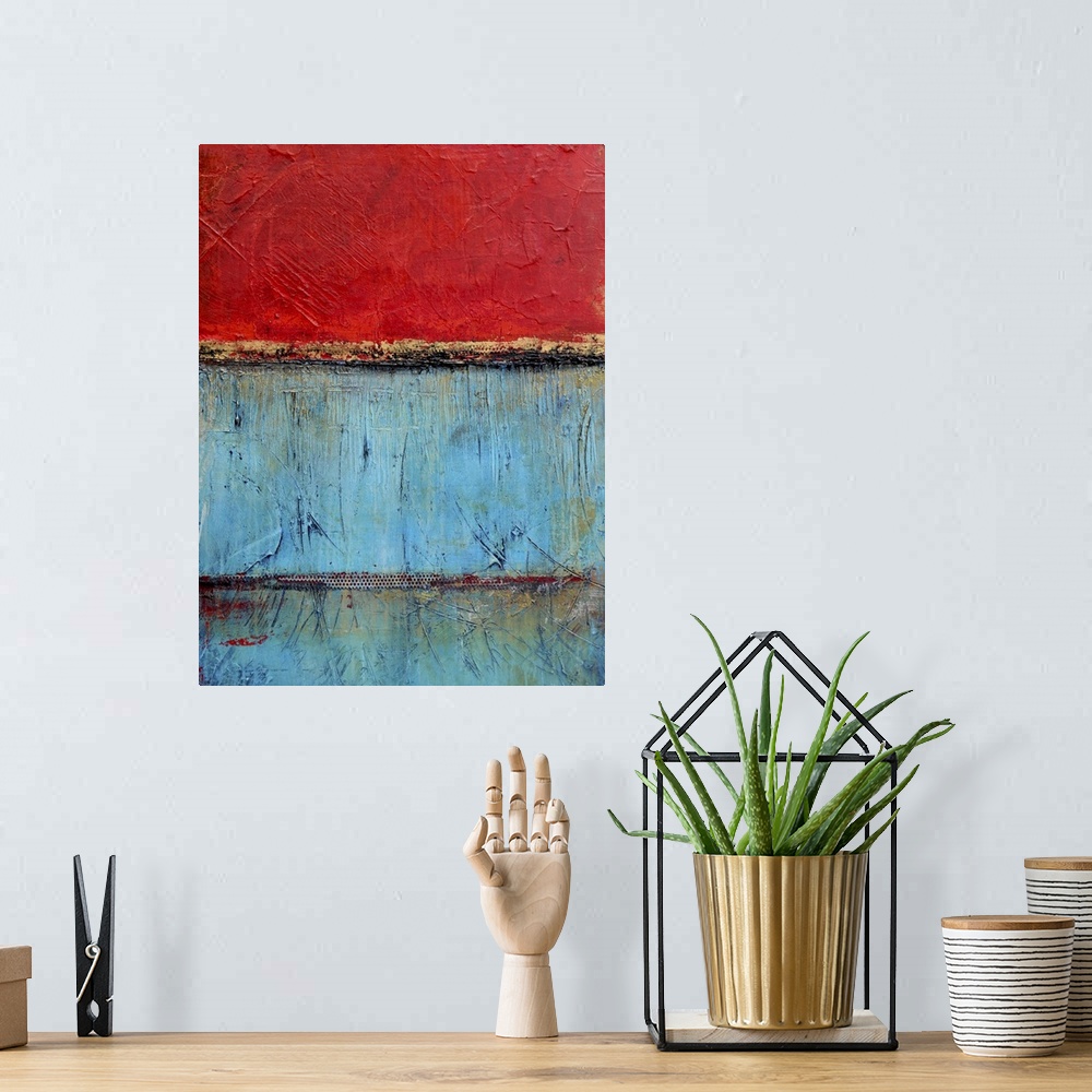 A bohemian room featuring Contemporary abstract painting using bright red and blue contrasting with each other.