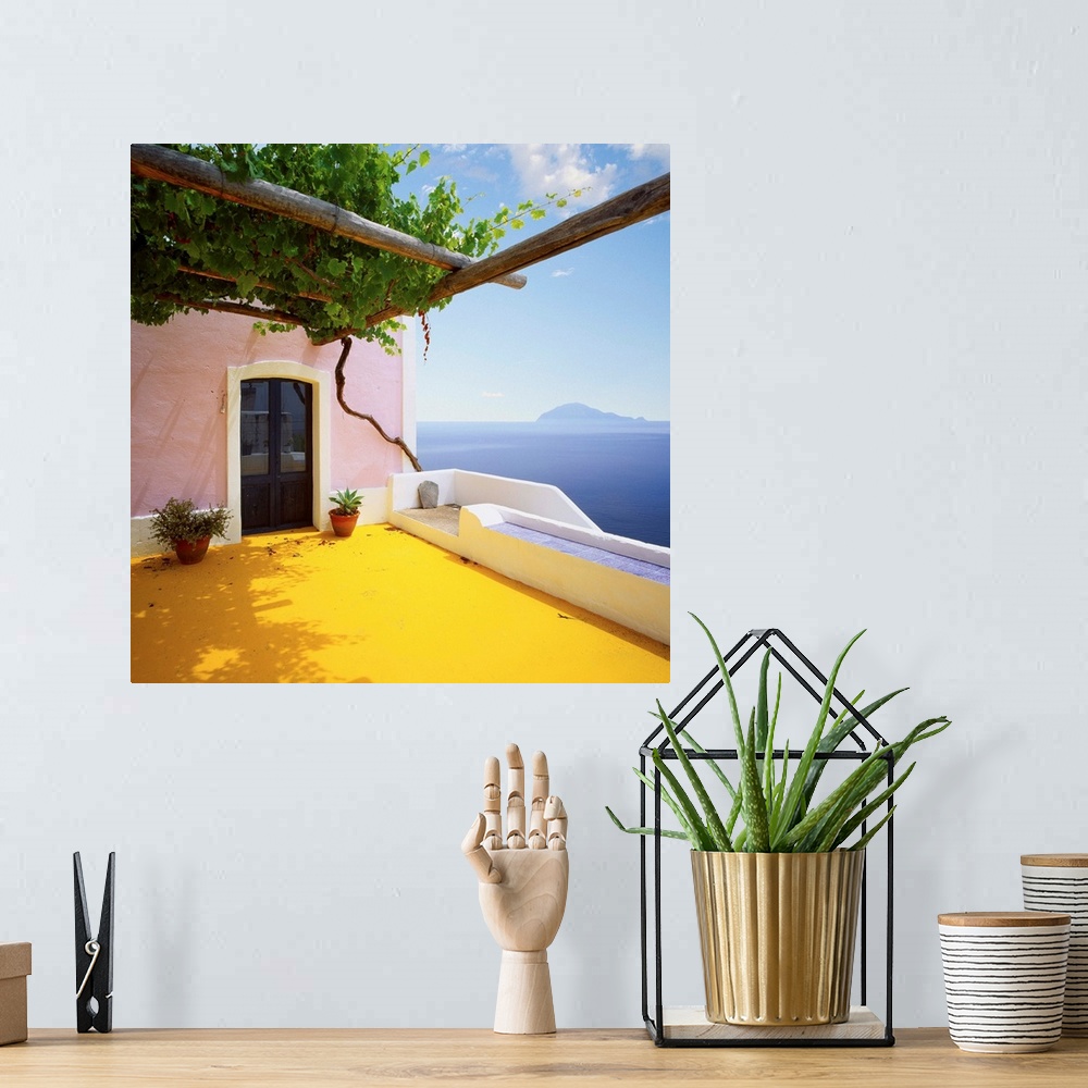A bohemian room featuring Italy, Sicily, Alicudi island, typical architecture and Filicudi island in background
