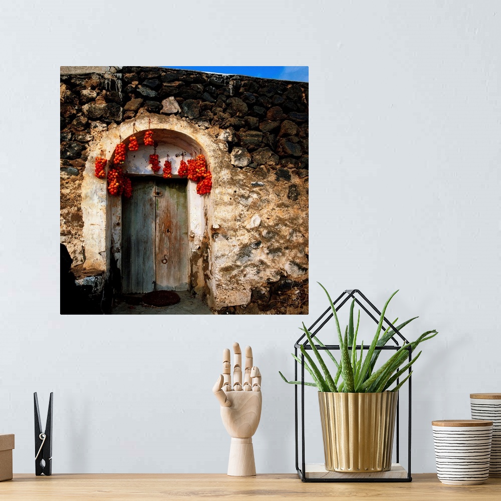 A bohemian room featuring Italy, Sicily, Pantelleria Island, typical door with hanging drying tomatoes