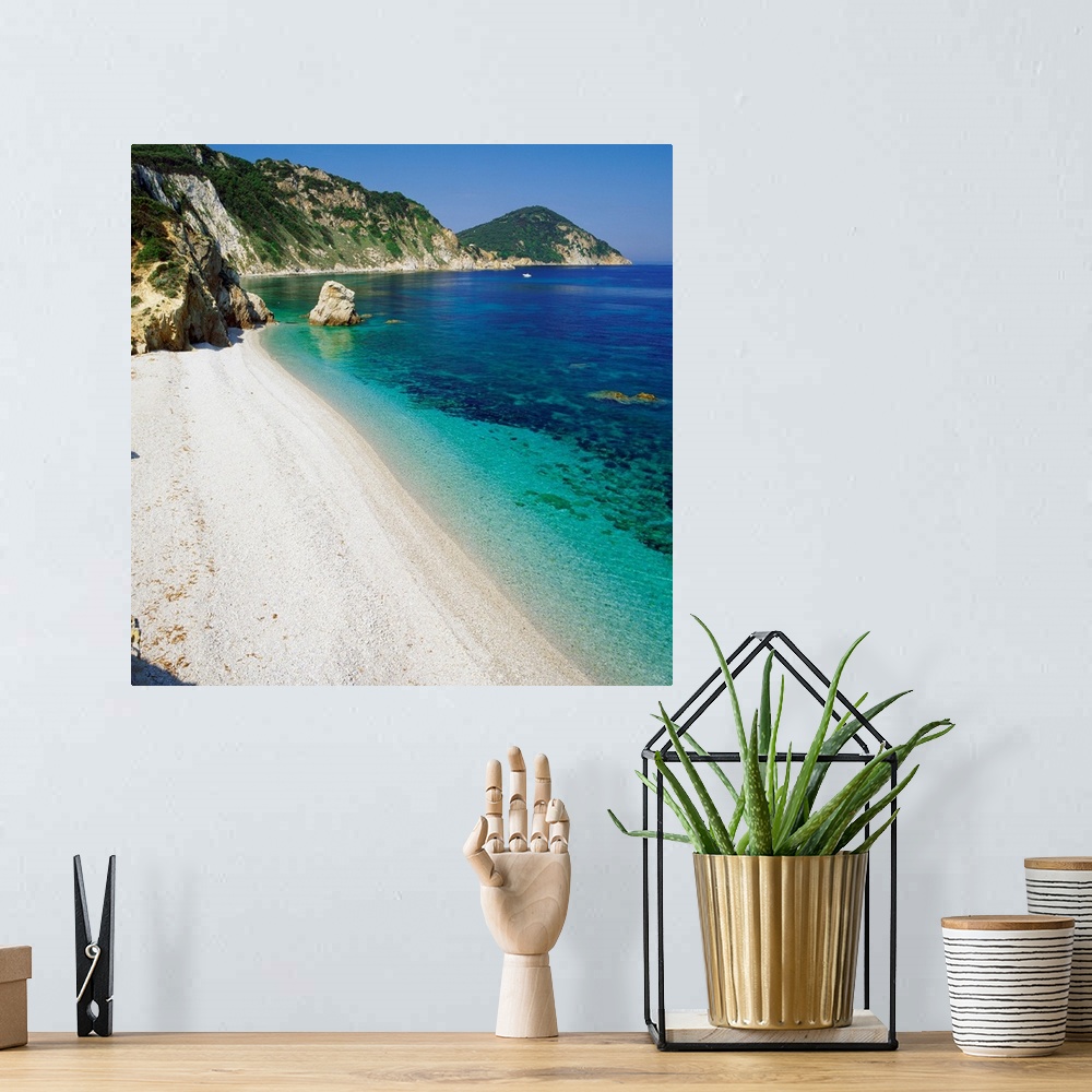 A bohemian room featuring Italy, Tuscany, Elba, Acquaviva beach, view towards Capo d'Enfola
