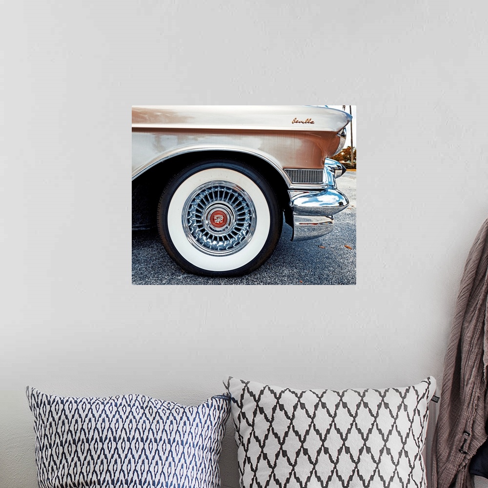 A bohemian room featuring Side view of a 1950's Cadillac Seville.