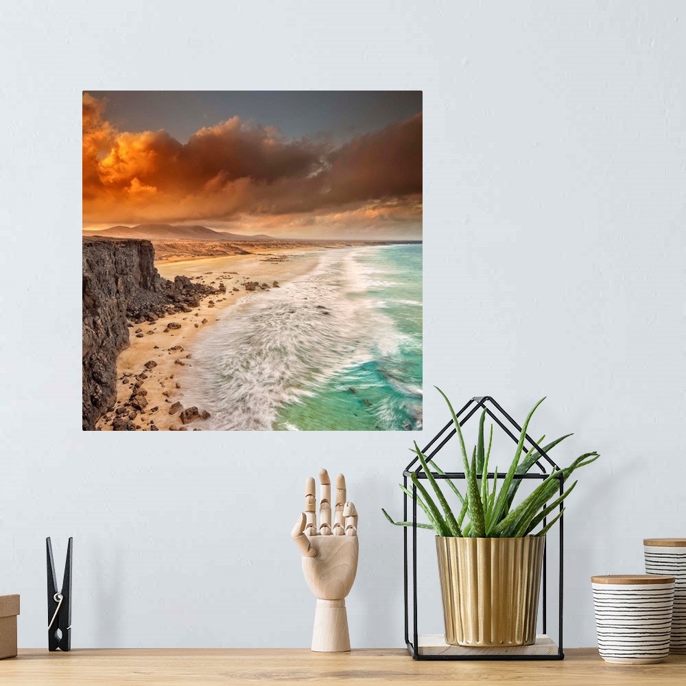 A bohemian room featuring Spain, Canary Islands, Fuerteventura, El Cotillo, Beach and rugged coastline at dawn