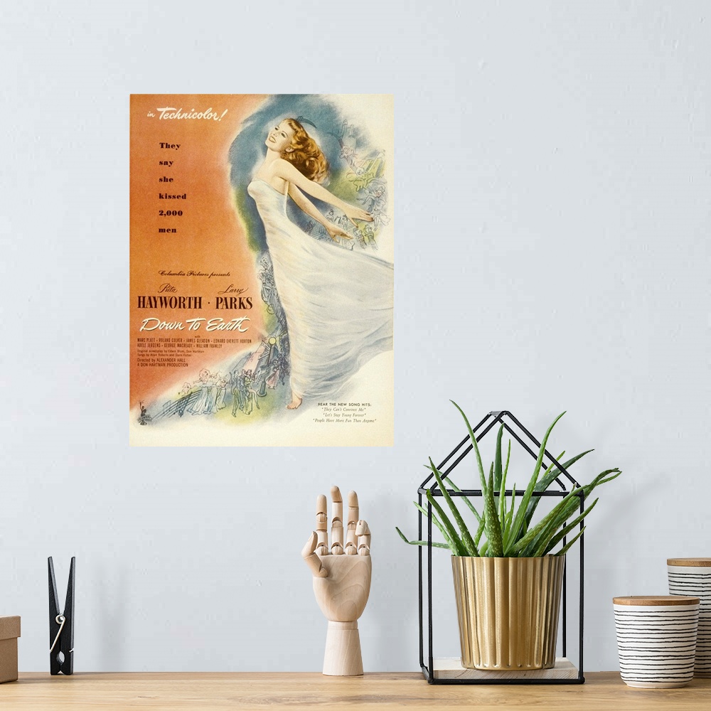 A bohemian room featuring Down to Earth - Vintage Movie Poster