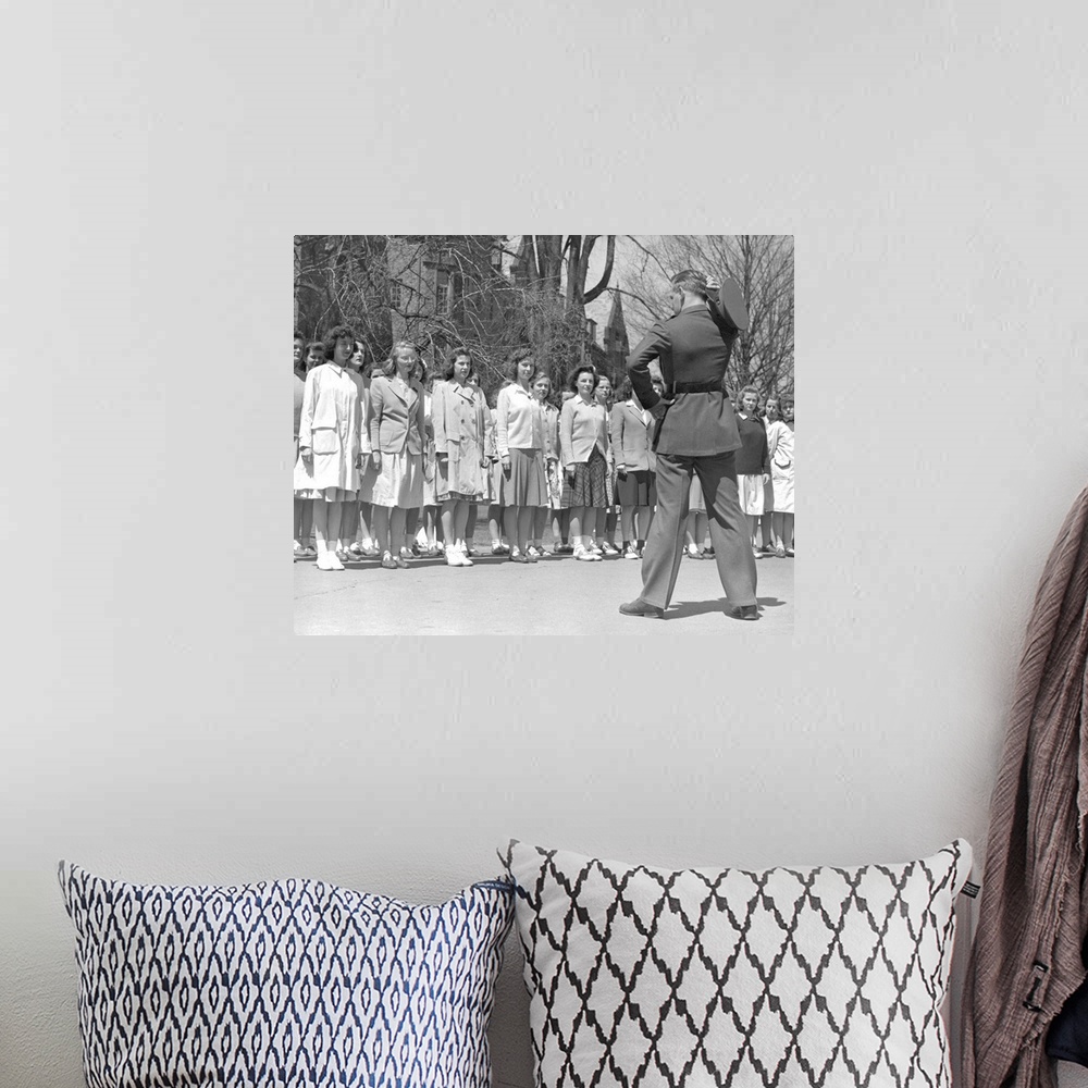 A bohemian room featuring Drill Instructor looks over new arrivals to Marine Corps Women's Reserve Officer's Candidate Scho...