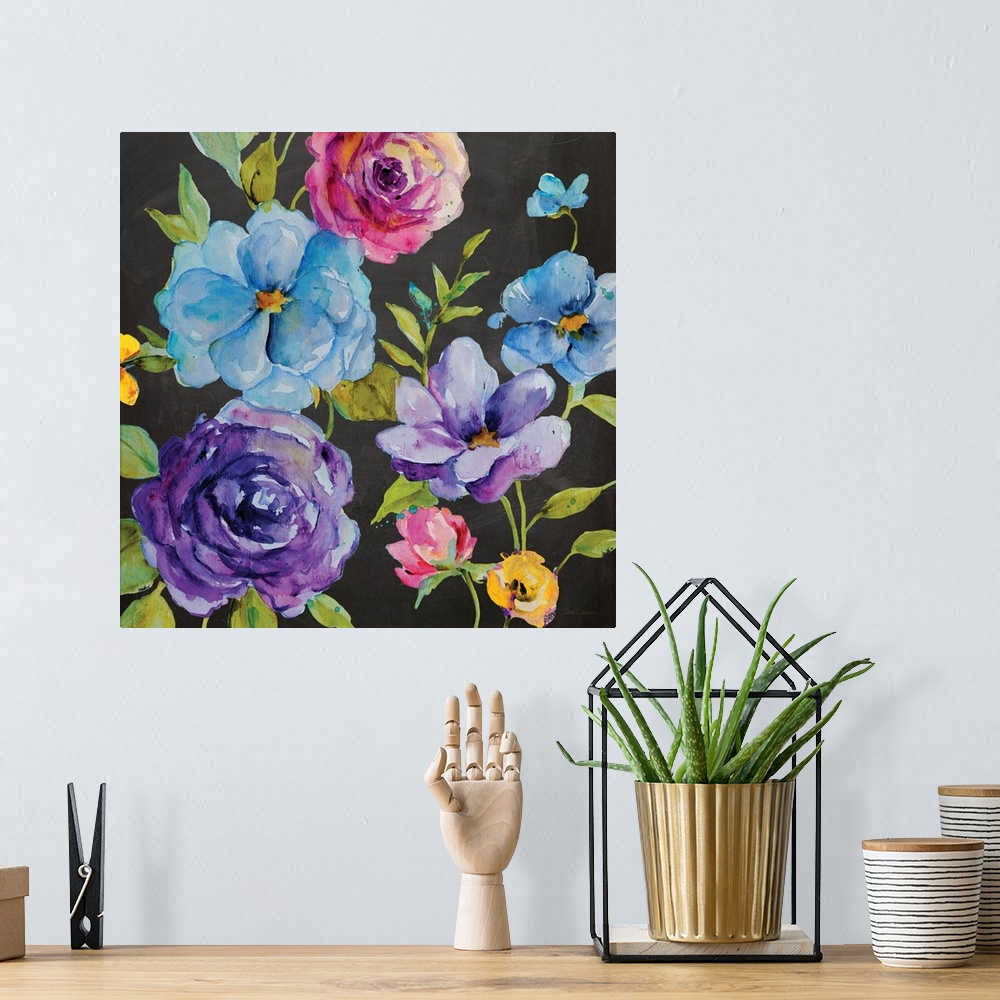 A bohemian room featuring An assortment of watercolor flowers rest on a chalkboard background.