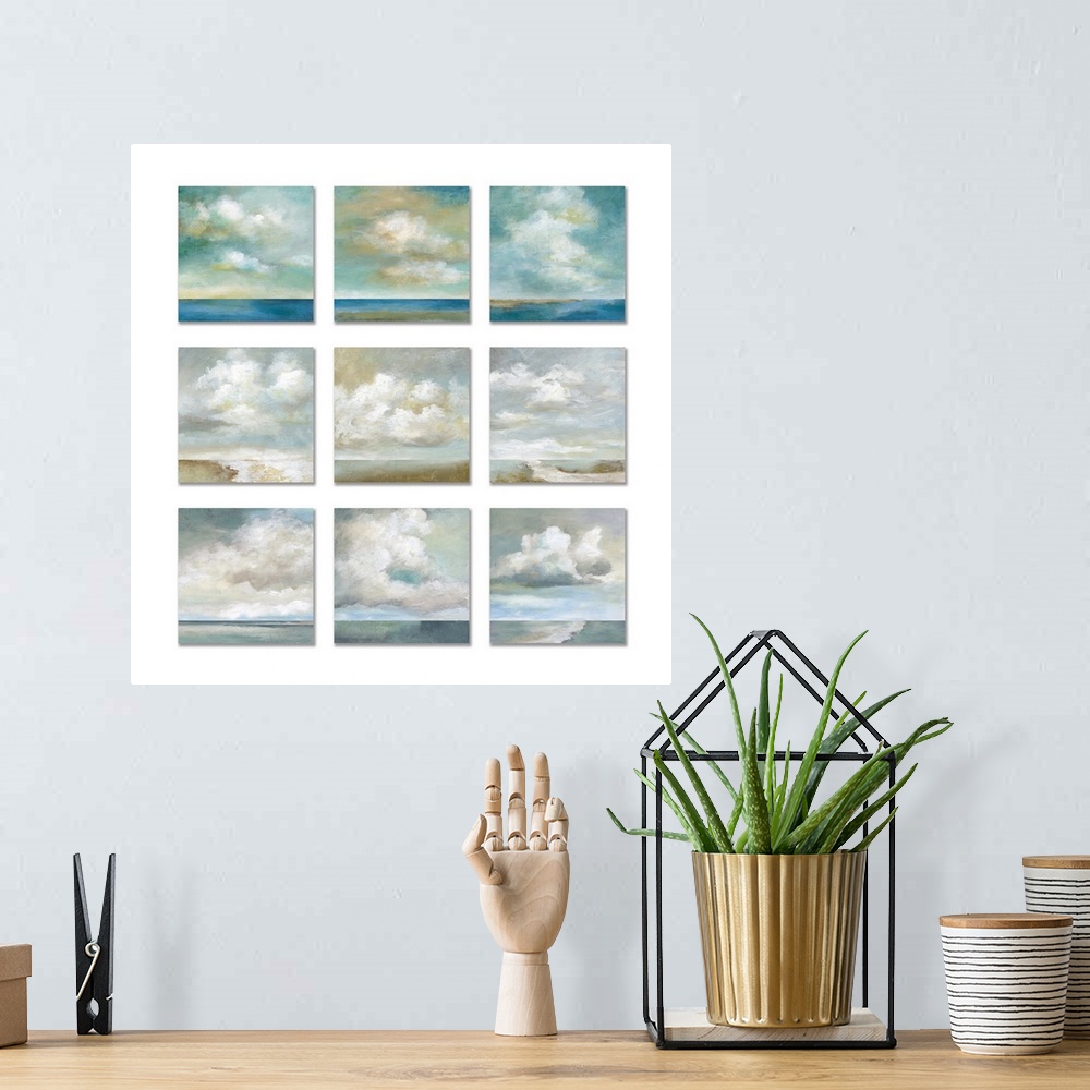 A bohemian room featuring Three by three square paintings of white fluffy clouds over a body of water against a white backg...
