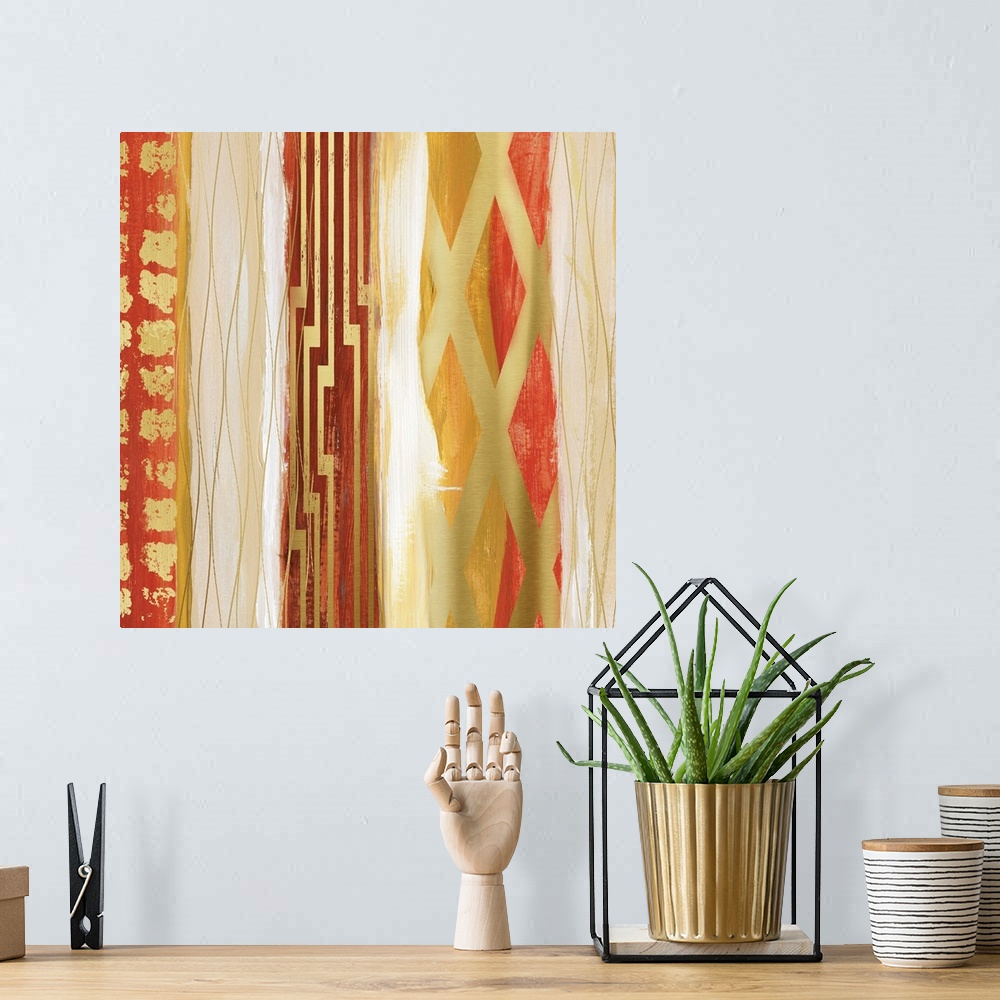 A bohemian room featuring Abstract painting in bold shades of gold and red in vertical bands with geometric patterns.