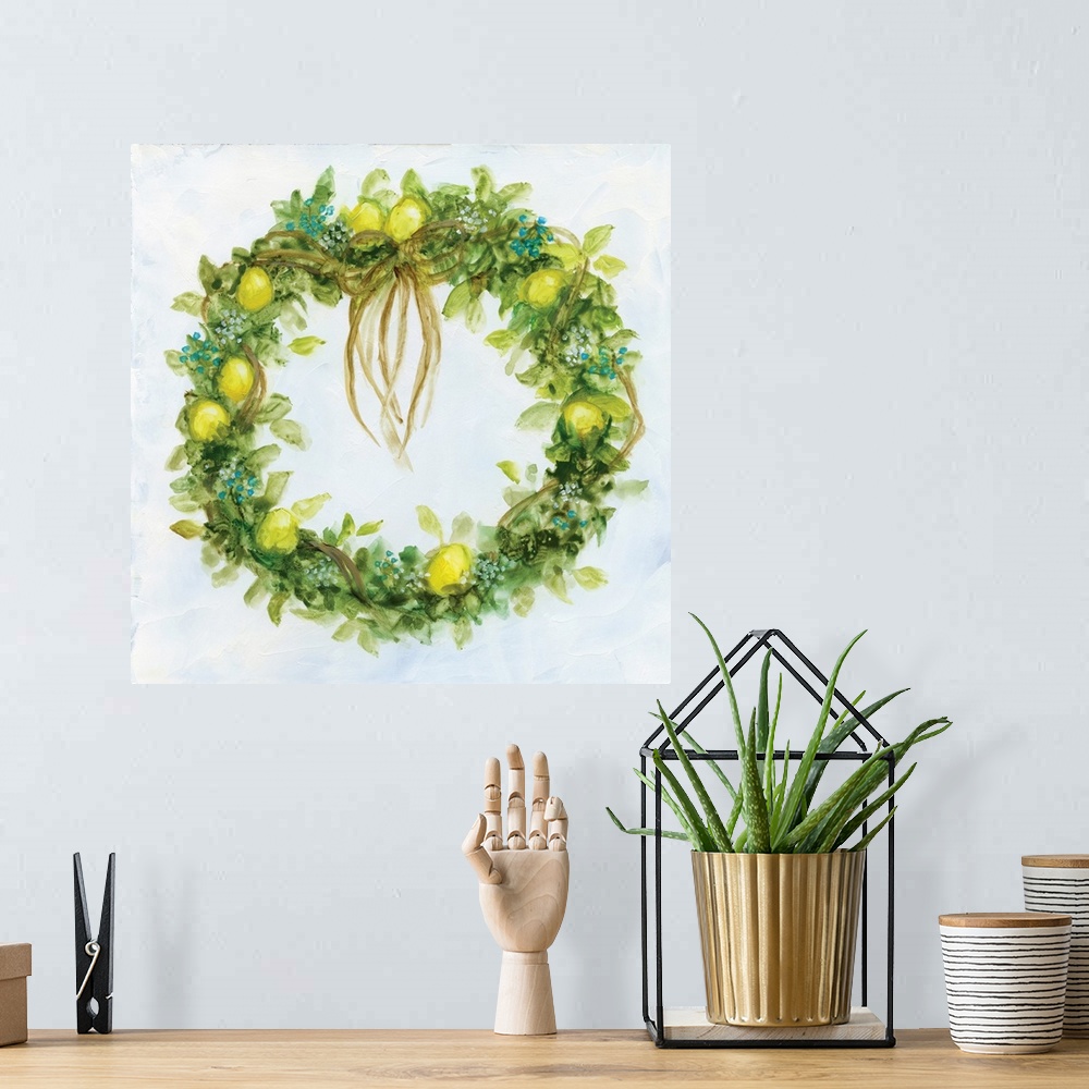 A bohemian room featuring Artwork of a leafy green wreath decorated with ribbons and lemons.
