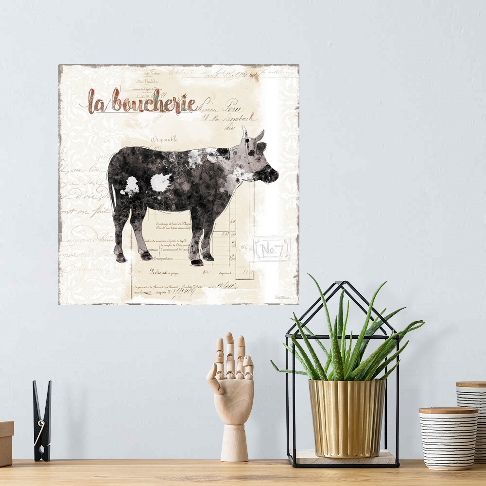 A bohemian room featuring A decorative painting of cow with a background that is beige with white deigns and a French writing.