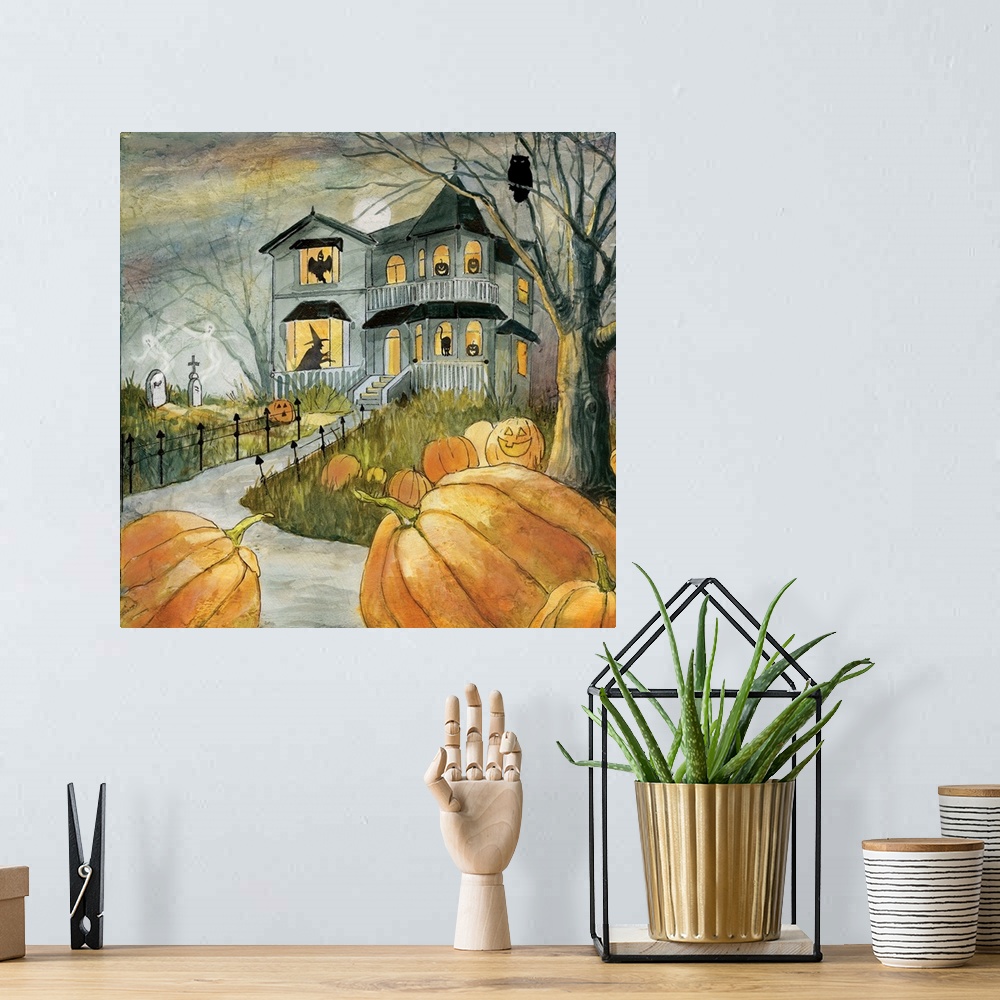 A bohemian room featuring A spooky haunted house with figures in the windows surrounded by pumpkins.
