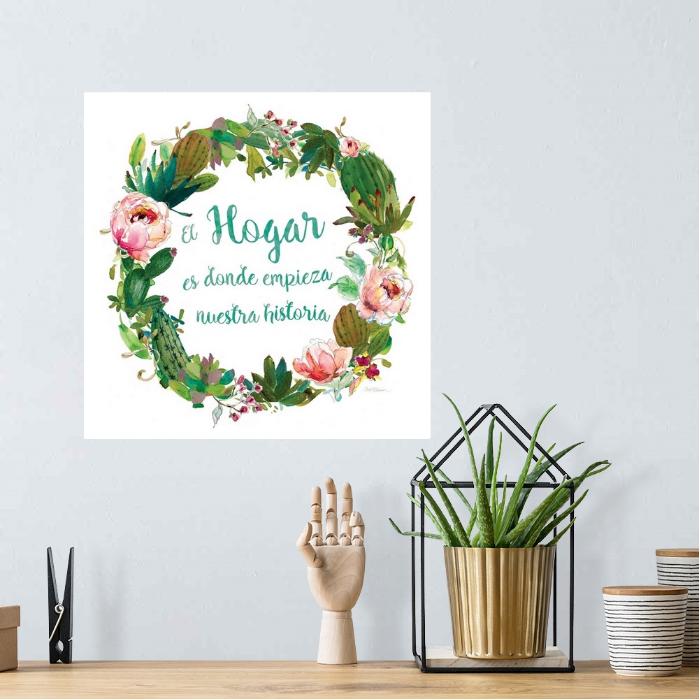 A bohemian room featuring A wreath of cacti, various flowers and foliage surround the words, "El hogar es donde empieza nue...