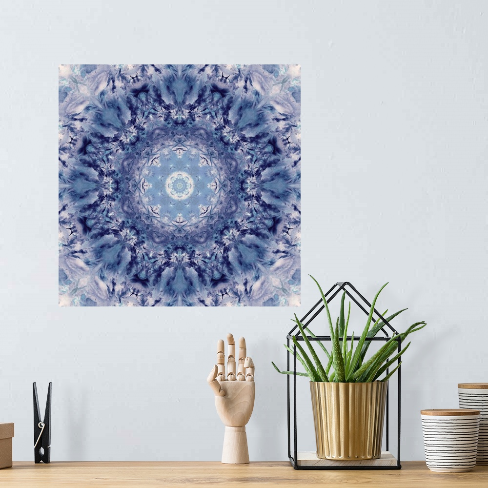 A bohemian room featuring Square abstract art in shades of blue and white hues with kaleidoscope-like patterns and designs.