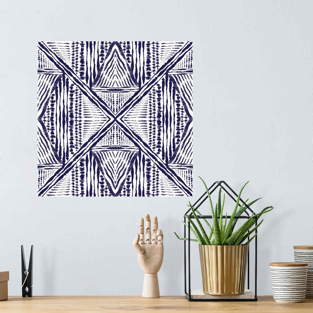 A bohemian room featuring Square abstract art in indigo and white hues with kaleidoscope-like patterns and designs.