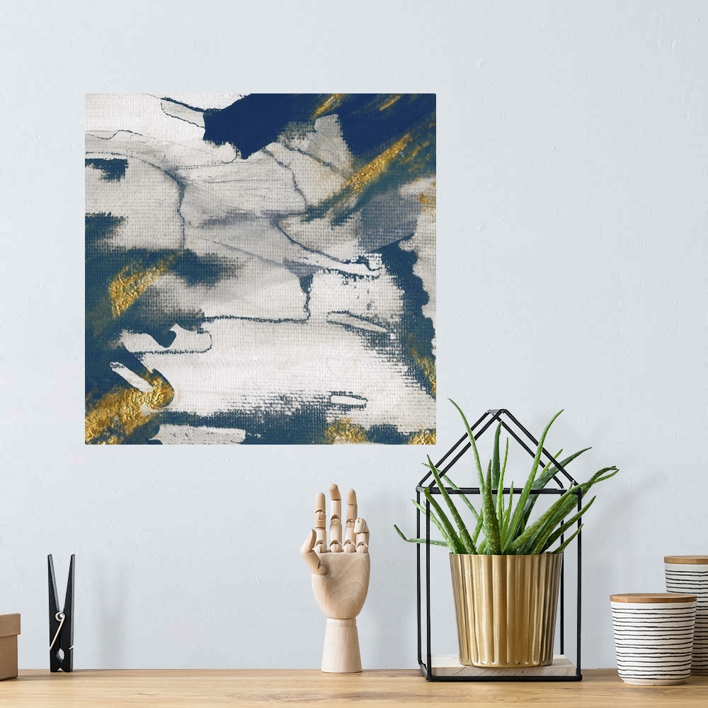 A bohemian room featuring Modern abstract artwork with shades of deep blue accented with gold.