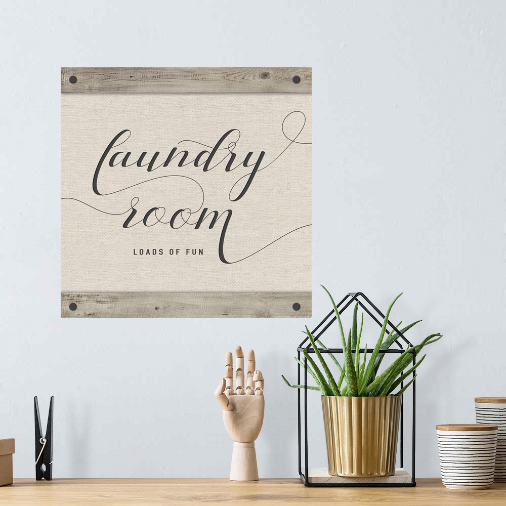 A bohemian room featuring Laundry Room 'Loads of Fun' neutral colored square sign.