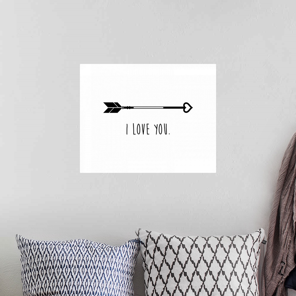 A bohemian room featuring An arrow with a heart tip and the phrase "I love you" underneath.