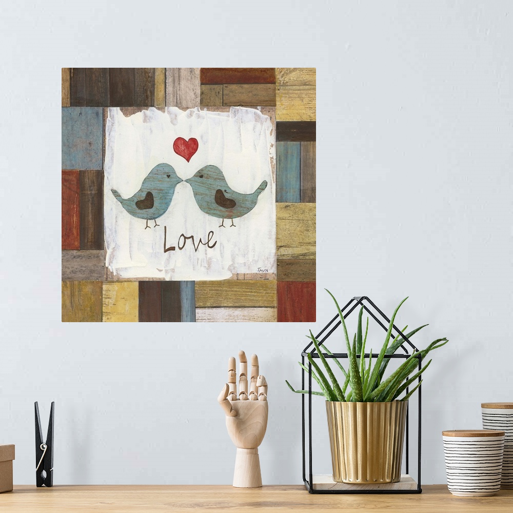 A bohemian room featuring A decorative painting that has the word ?Love? and two blue birds kissing, painted on a multi-col...