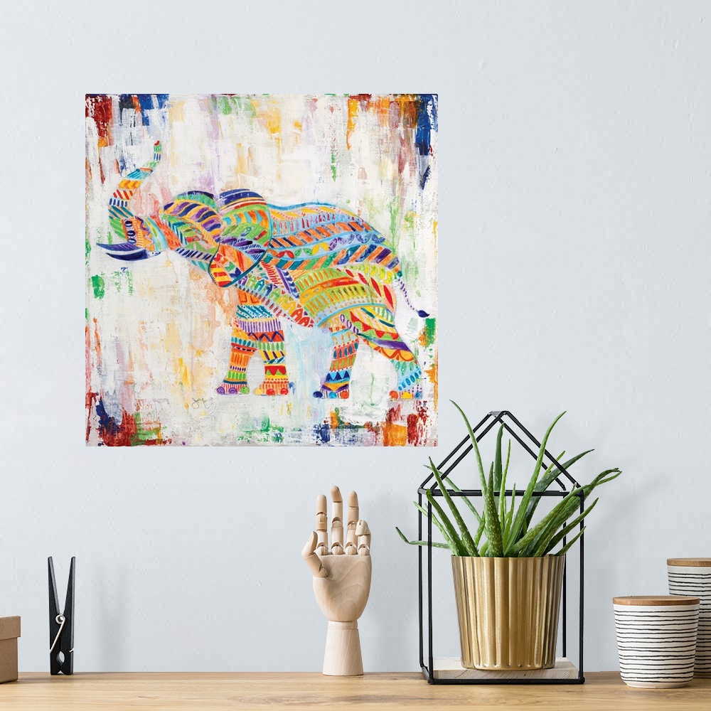 A bohemian room featuring A painting of an elephant made up of unique multi-colored designs.