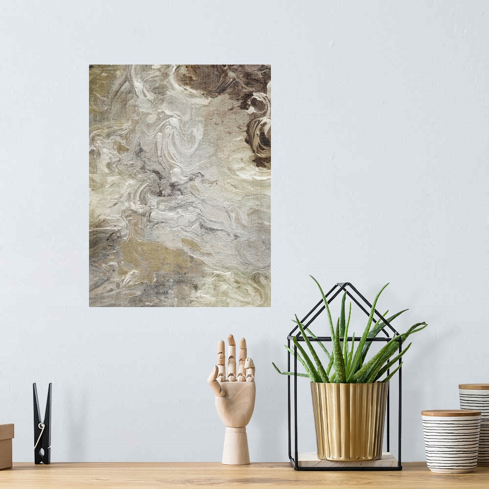 A bohemian room featuring Abstract painting of neutral colors marbled together.