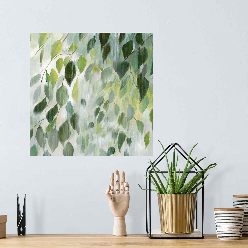 A bohemian room featuring Square painting of leaves in shades of green with a white misty overlay on a white background.