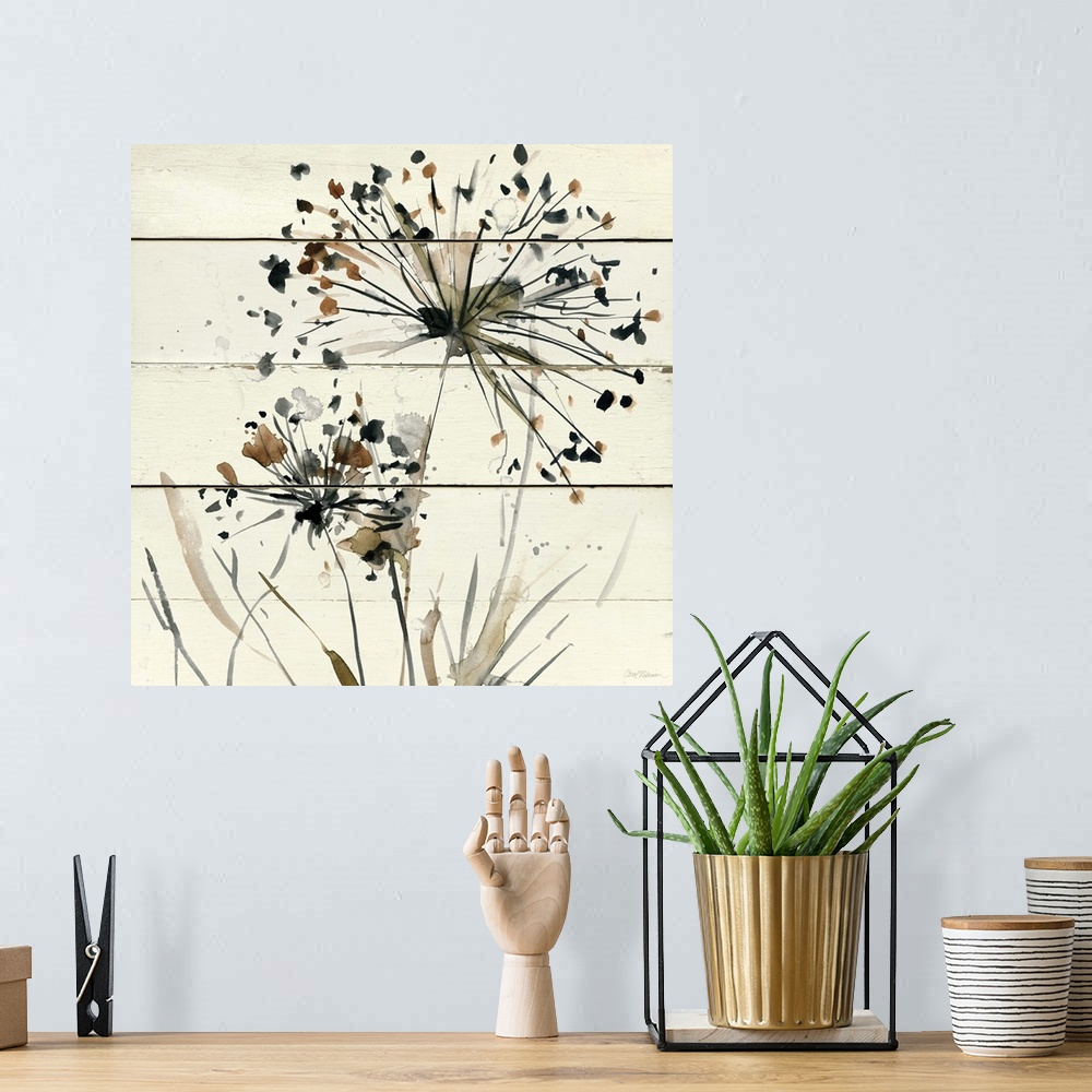A bohemian room featuring Square abstract watercolor painting of neutral toned dandelions on a white wood paneled background.