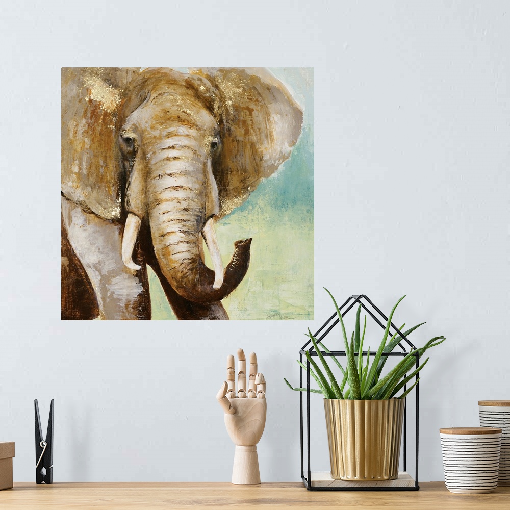 A bohemian room featuring Square painting of an elephant in brown tones with metallic gold highlights, on a blue and green ...