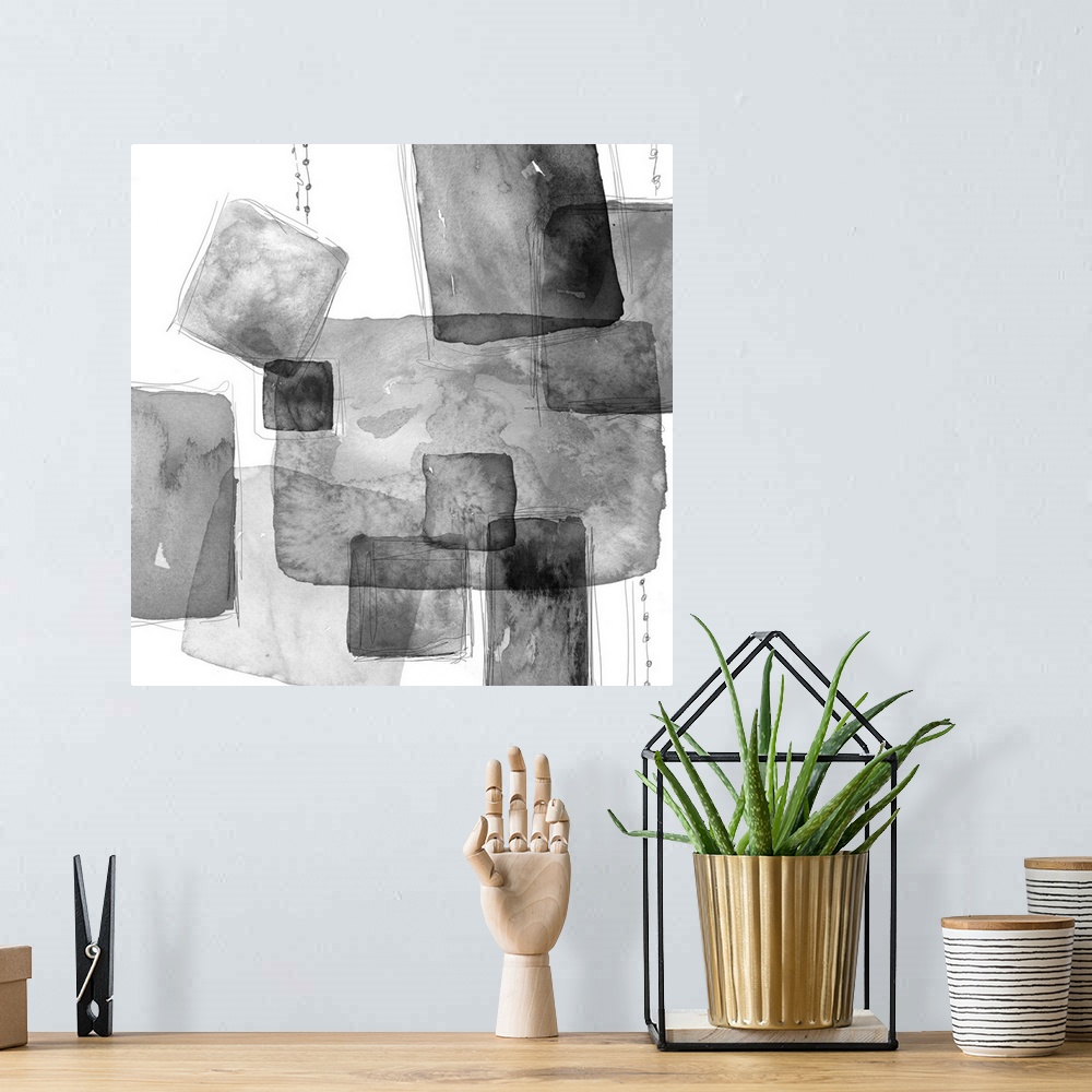 A bohemian room featuring Abstract watercolor painting of square shapes in shades of grey.