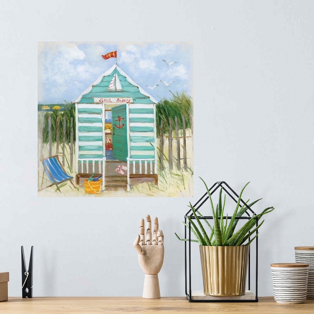 A bohemian room featuring Square painting of a teal and white beach hut with the ocean in the distance.