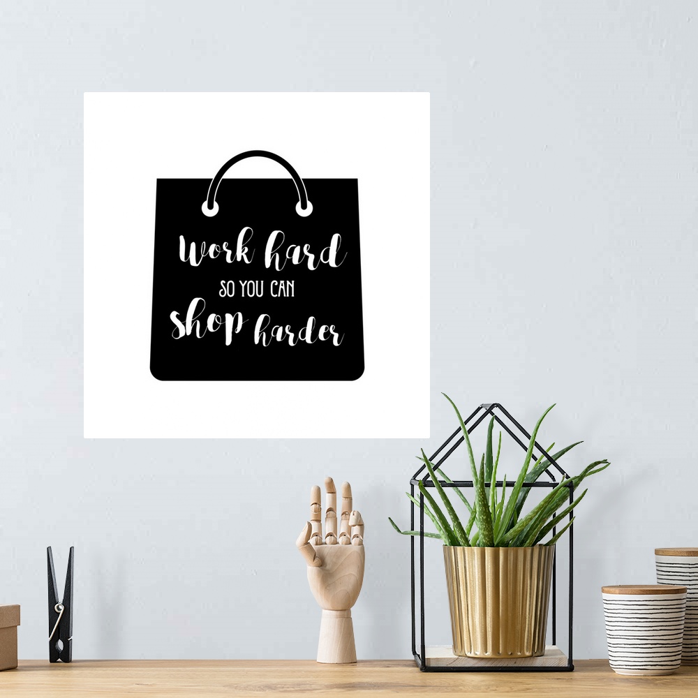A bohemian room featuring Decorative artwork with the text "Work Hard So You Can Shop Harder" on a handbag.