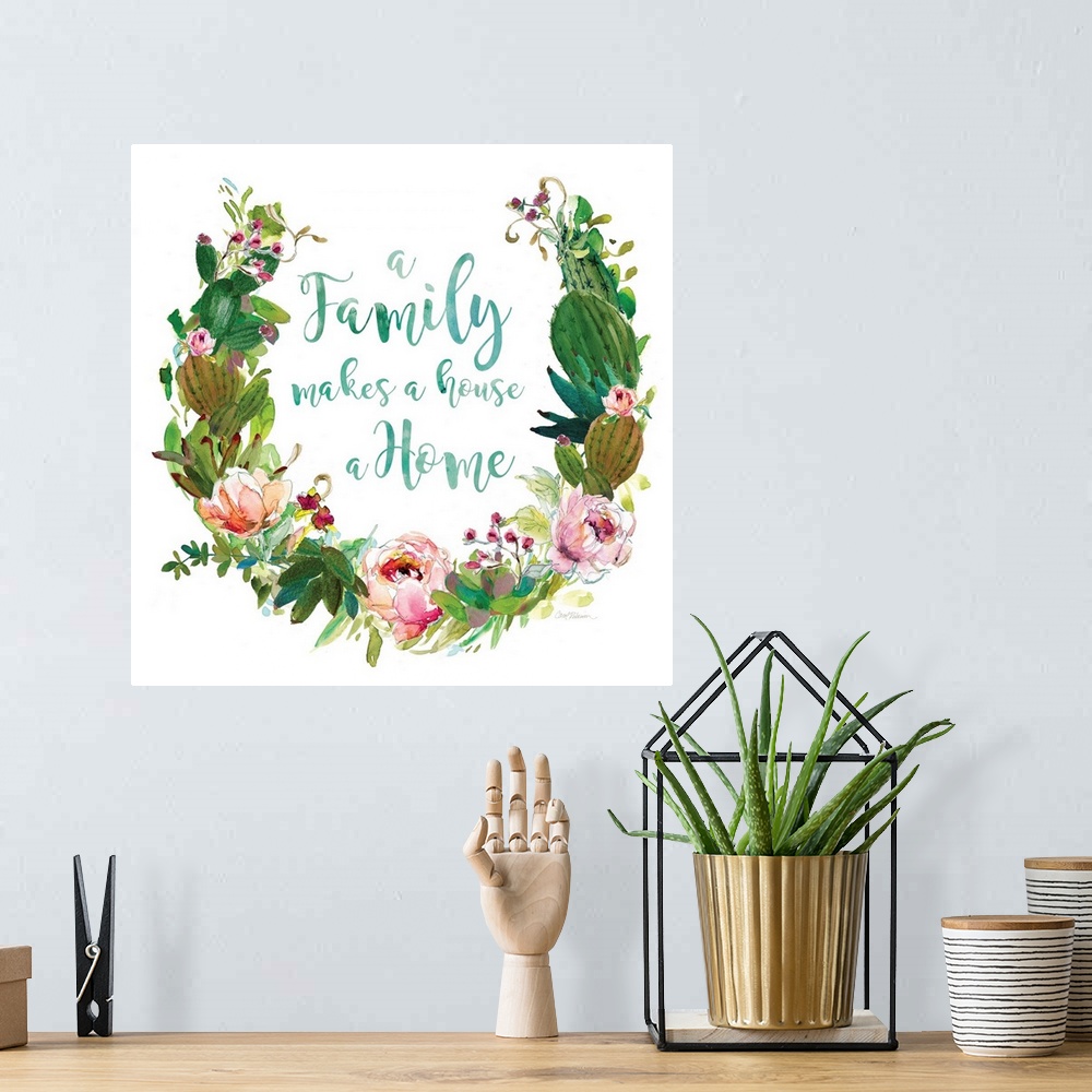 A bohemian room featuring Square watercolor painting with a wreath made out of flowers and succulents and the phrase "A Fam...