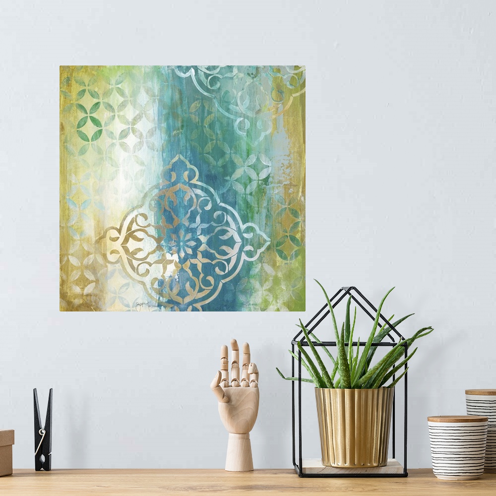 A bohemian room featuring Square painting in teal, gold, green, and white with a patterned print.