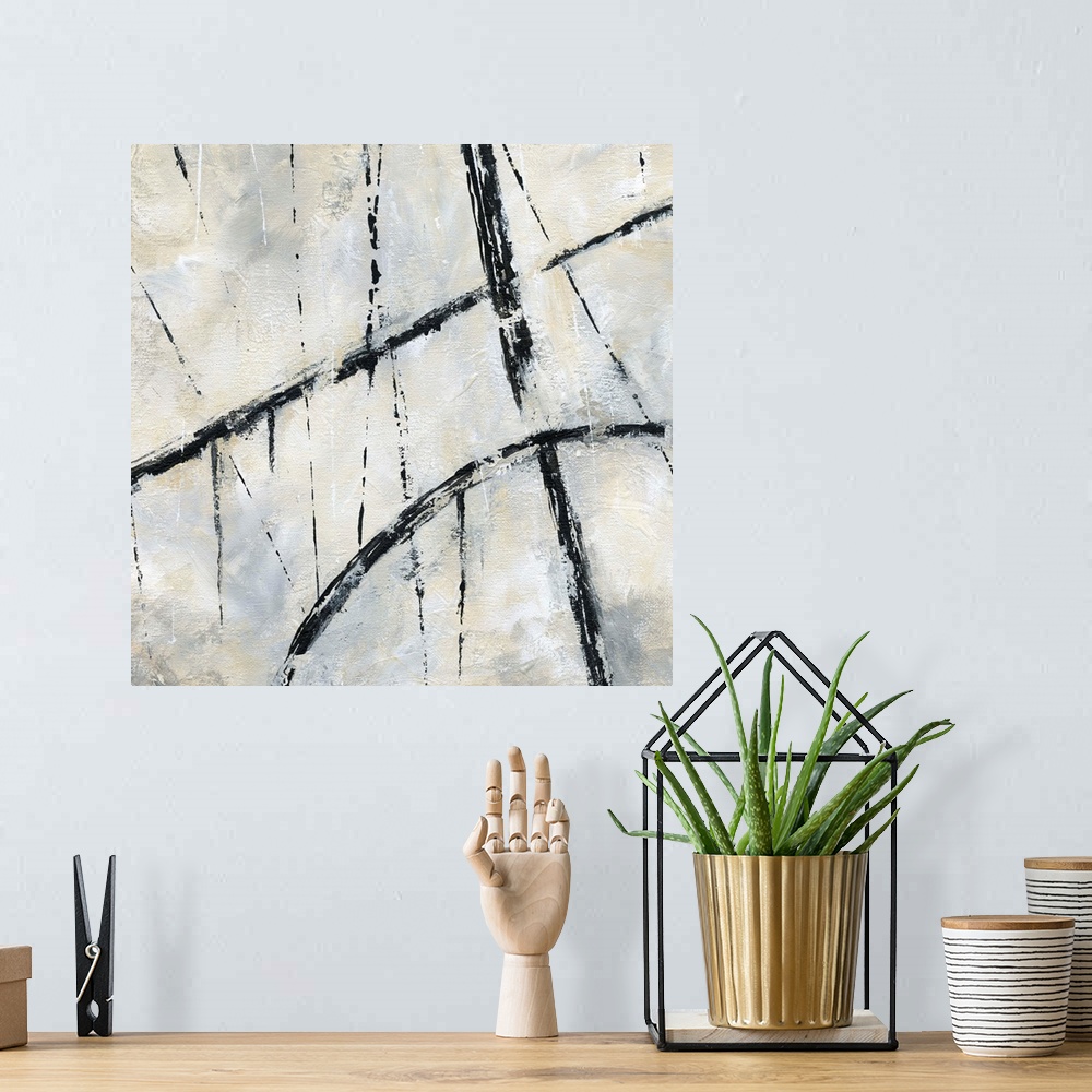 A bohemian room featuring Square abstract painting with bold, black, dripping lines mixed with thin black lines on a white,...