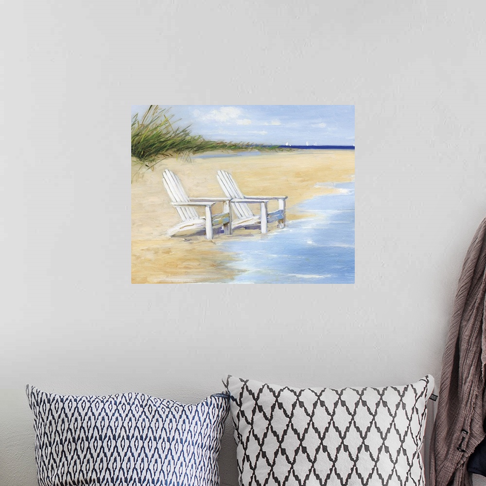A bohemian room featuring Contemporary painting of two white chairs on a sandy beach with the tide coming in.