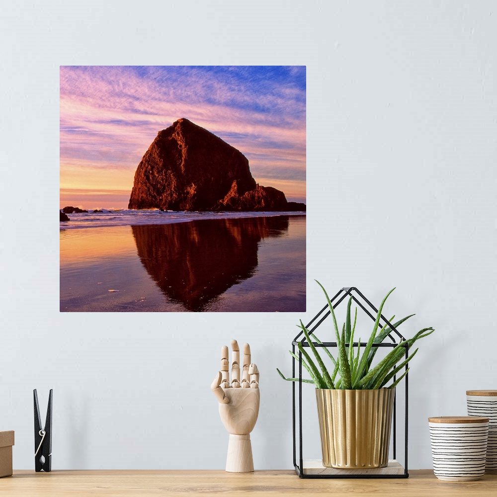 A bohemian room featuring Sunset over the sea stacks at Cannon Beach, Oregon.
