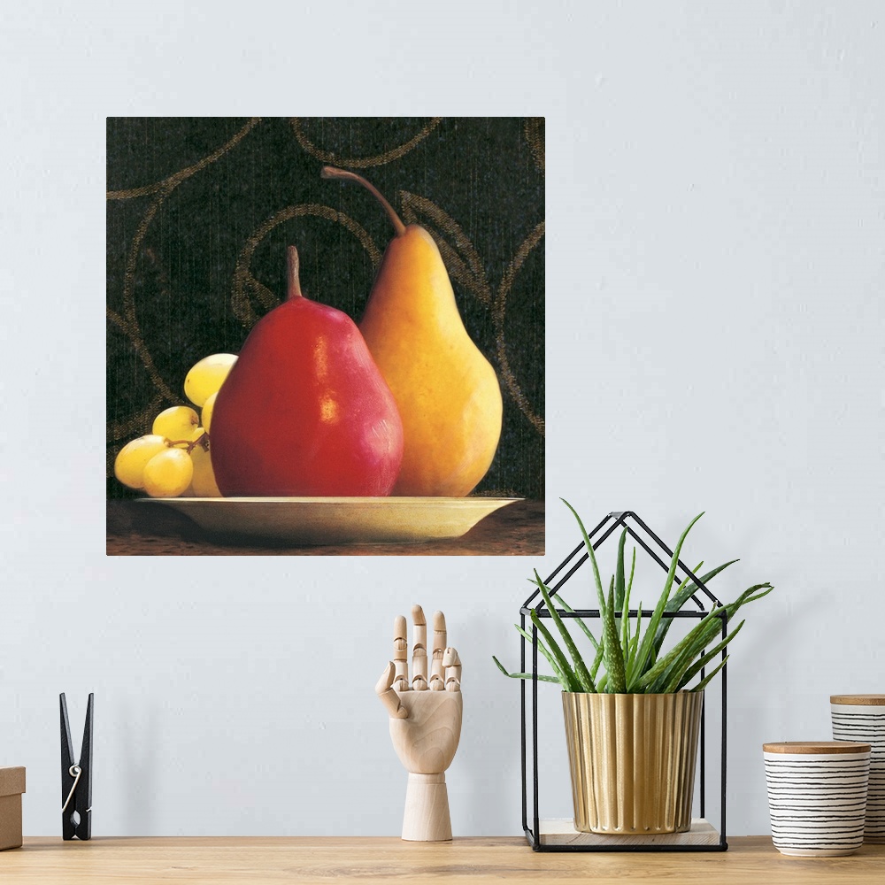 A bohemian room featuring Two pears and a bunch of grapes on a plate with a wallpapered background.