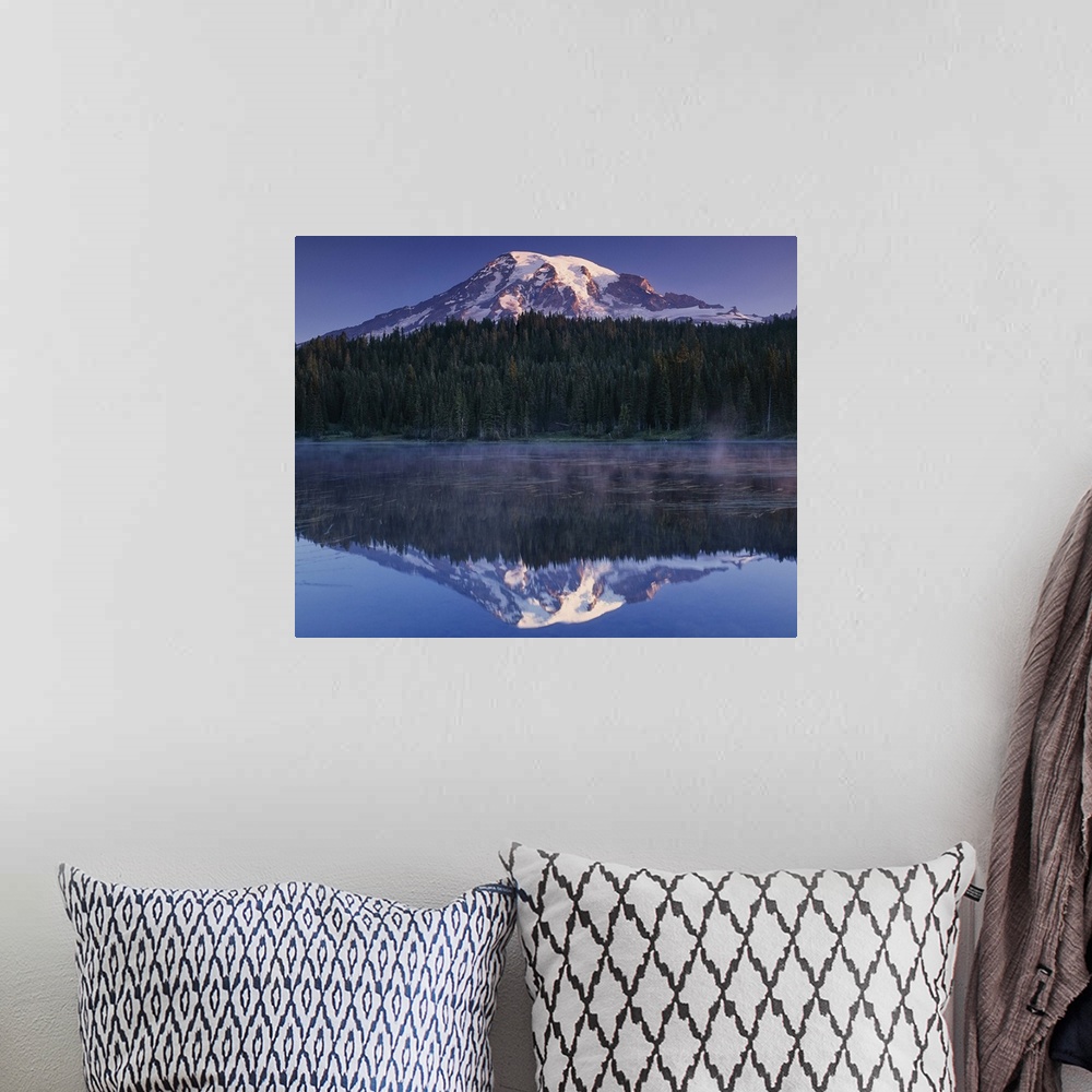 A bohemian room featuring Mount Rainier and the surrounding forests reflected in a lake, Washington.