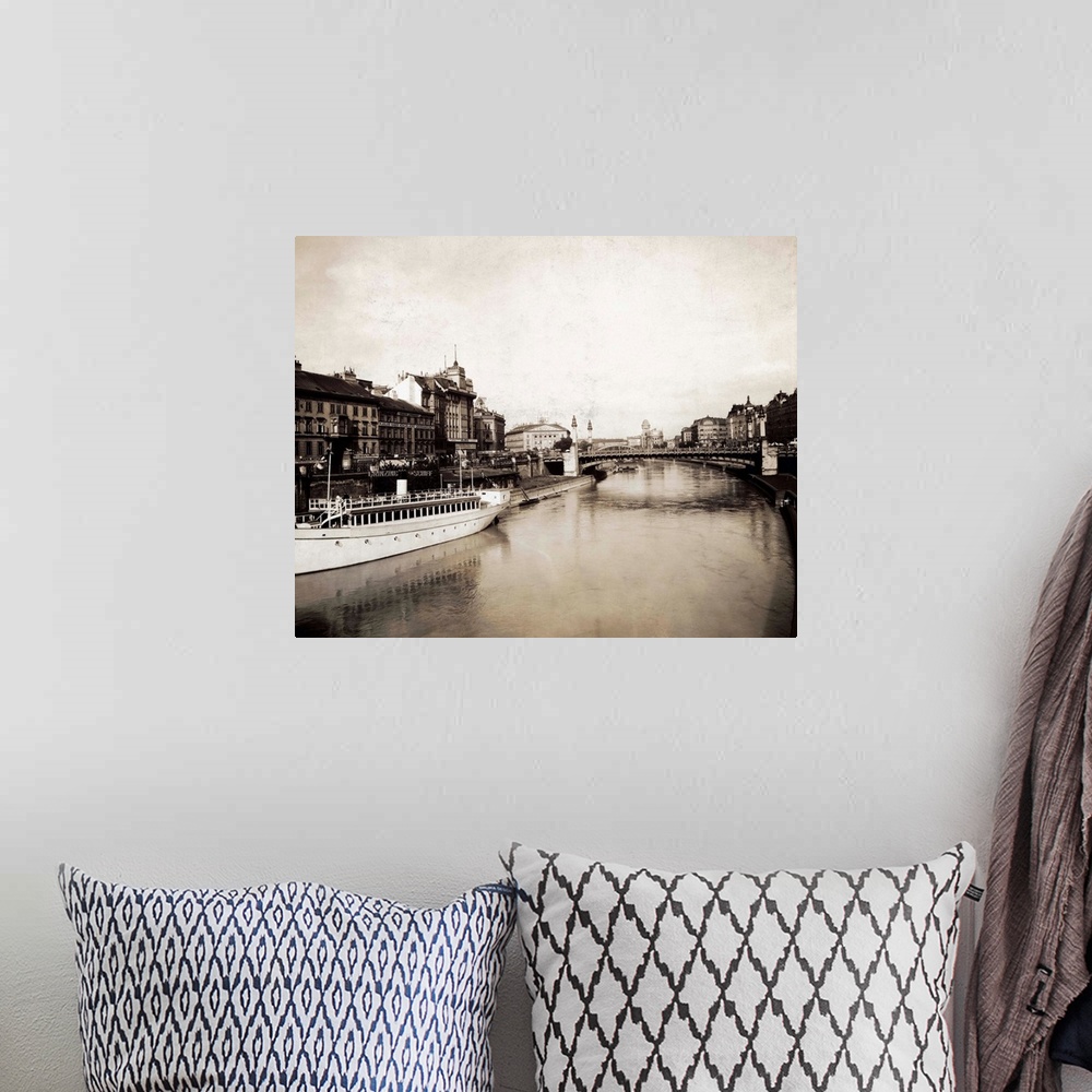 A bohemian room featuring Photo shows the Schwedenbrucke over the Danube River. The bridge is made famous by the popular co...