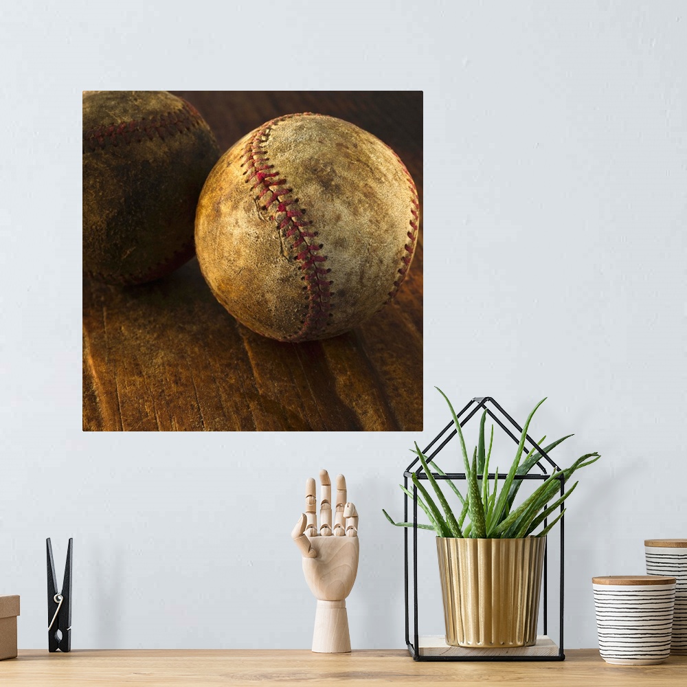 A bohemian room featuring Antique baseballs on wooden floor