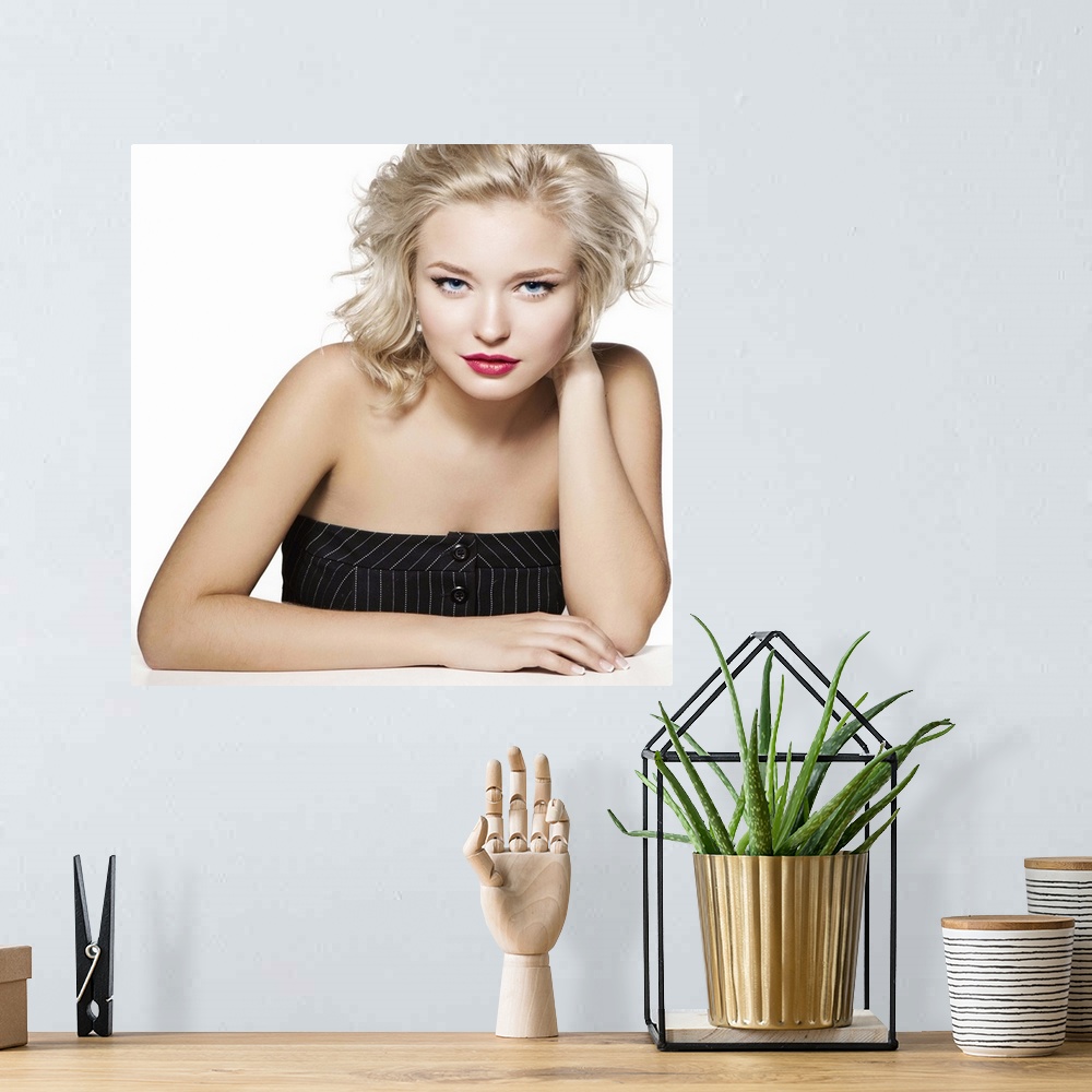 A bohemian room featuring Beauty portrait of young blonde, professional hairstyle and make-up