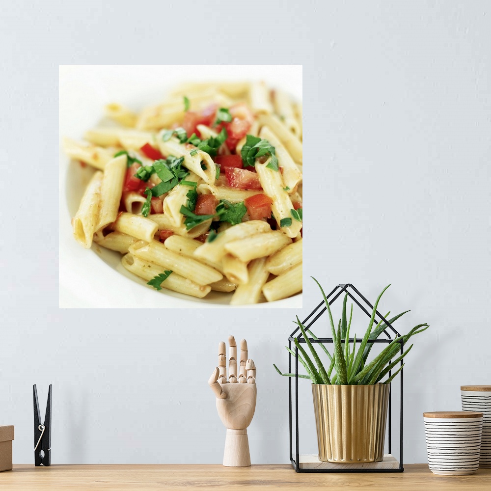 A bohemian room featuring close-up of a bowl of penne pasta