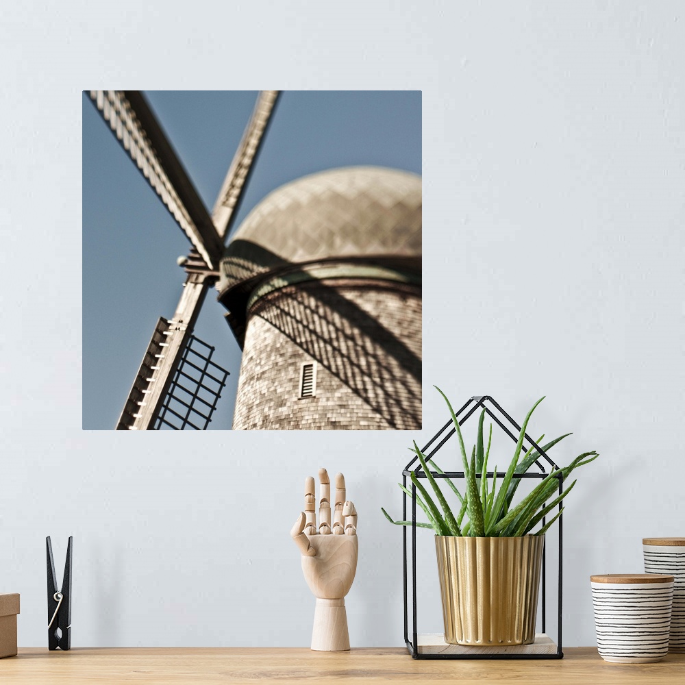 A bohemian room featuring close up of a Dutch windmill.