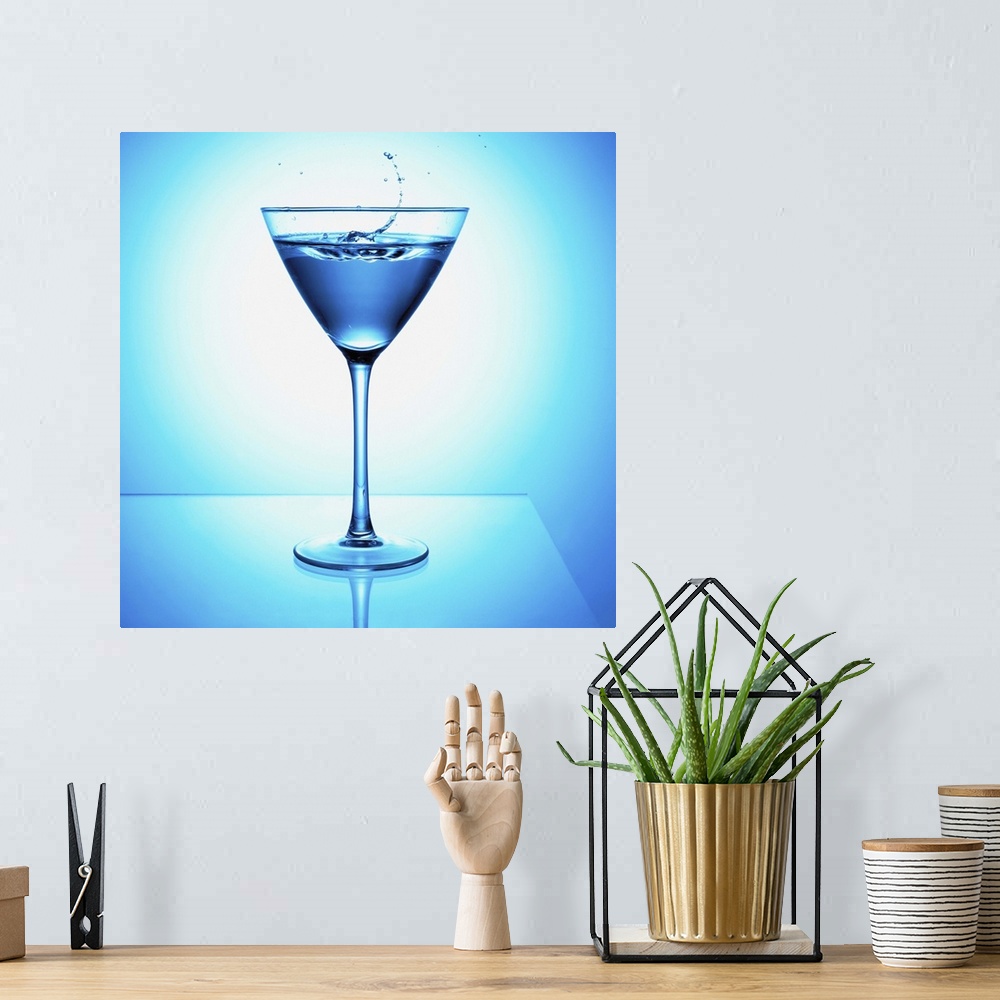 A bohemian room featuring Close up of blue martini cocktail