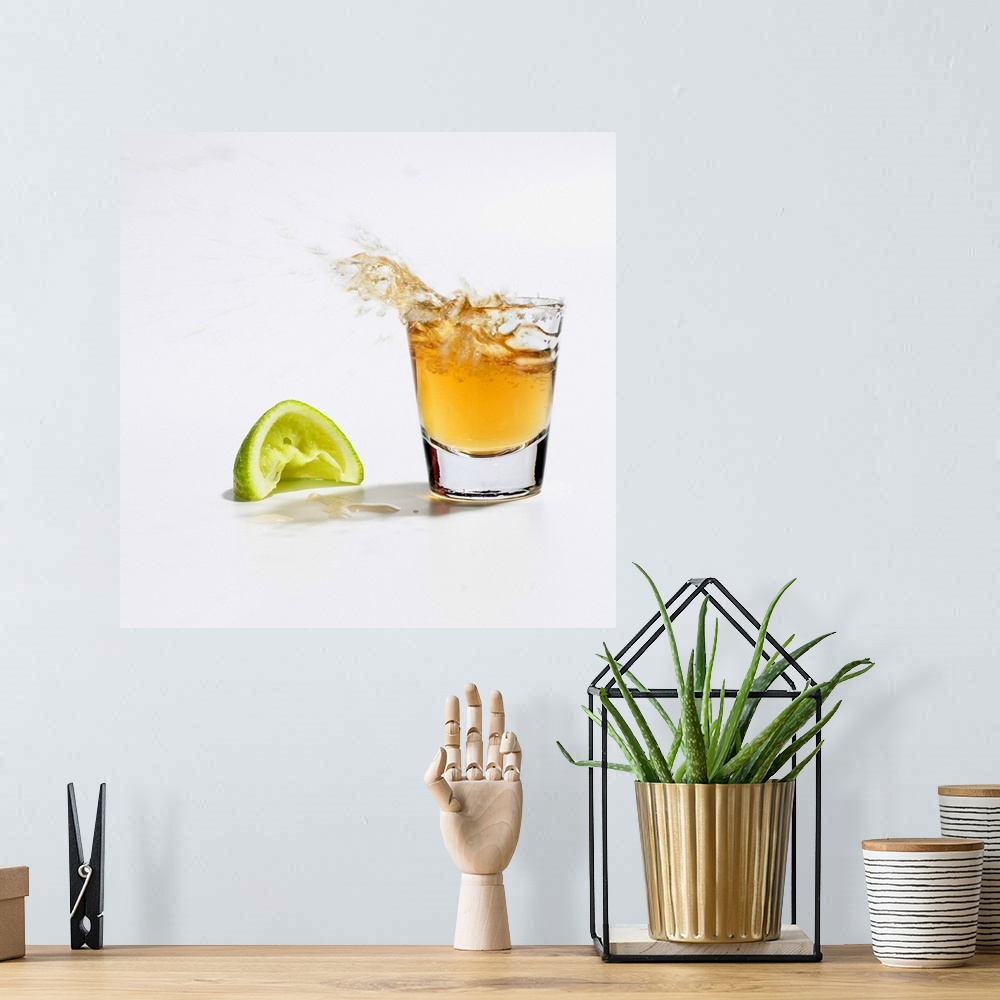 A bohemian room featuring Close up of tequila splashing out of glass