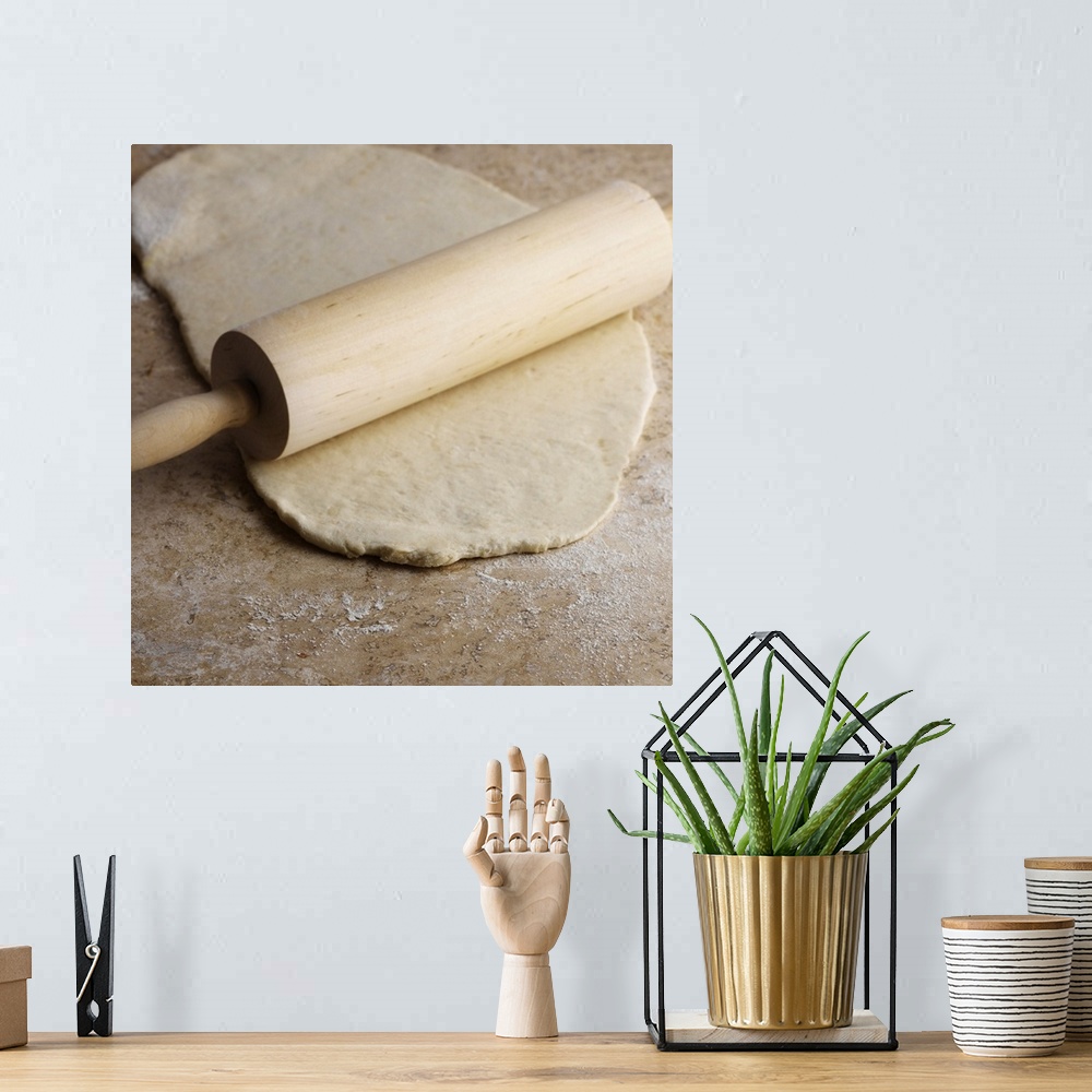 A bohemian room featuring Dough and rolling pin on countertop