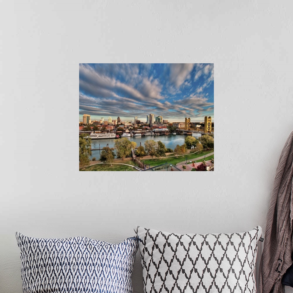 A bohemian room featuring Clouds over cityscape of  Downtown Sacramento at sunset.