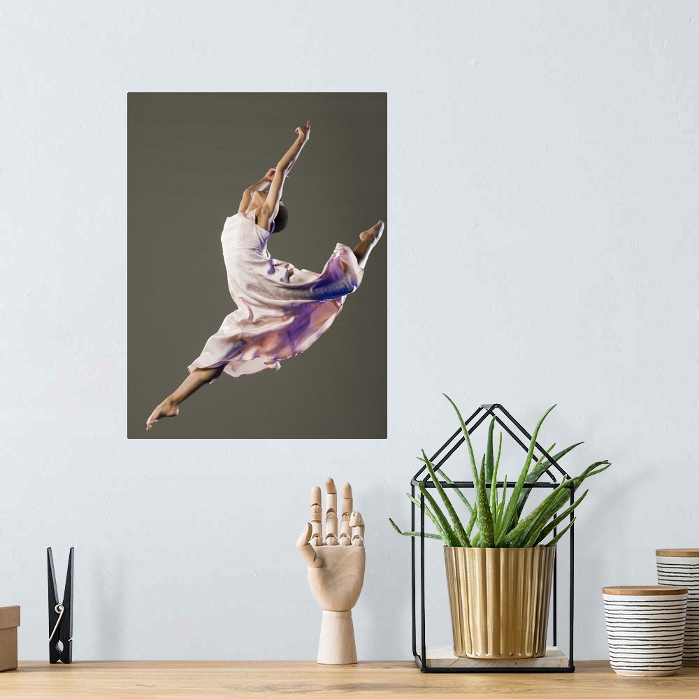 A bohemian room featuring African female ballet dancer jumping