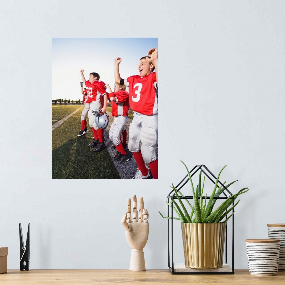 A bohemian room featuring Football players cheering on sideline